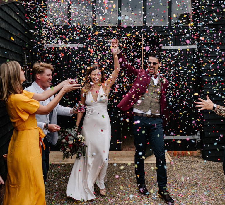 Confetti moment at High Billinghurst Farm by Epic Love Story