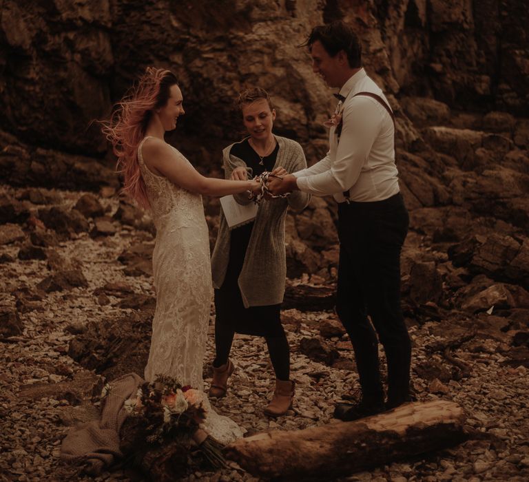 Windy elopement with hand fastening ceremony