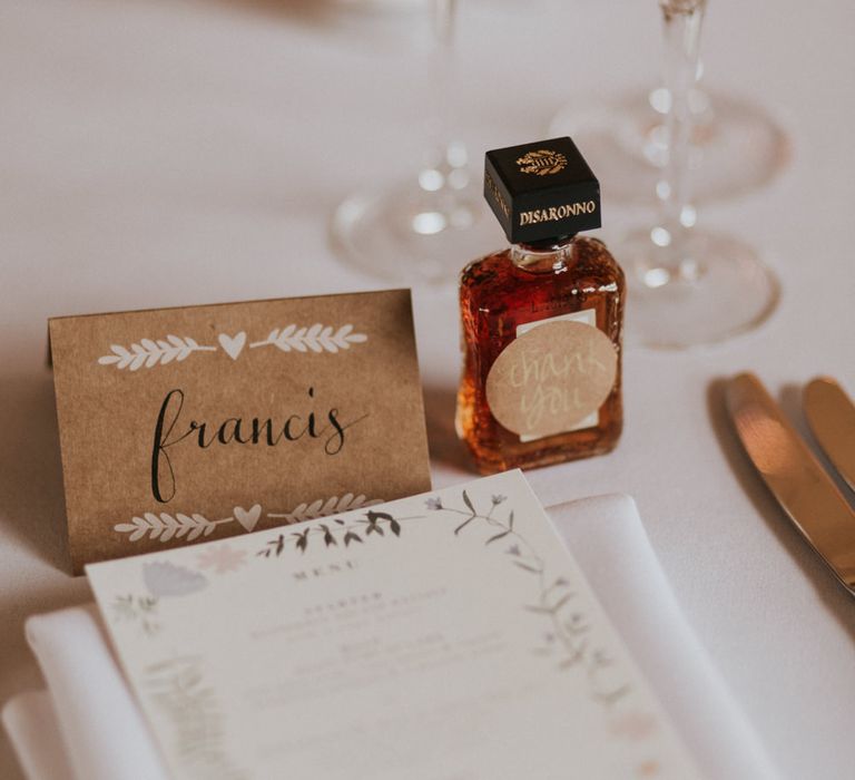 Miniature alcohol wedding favour at place setting 