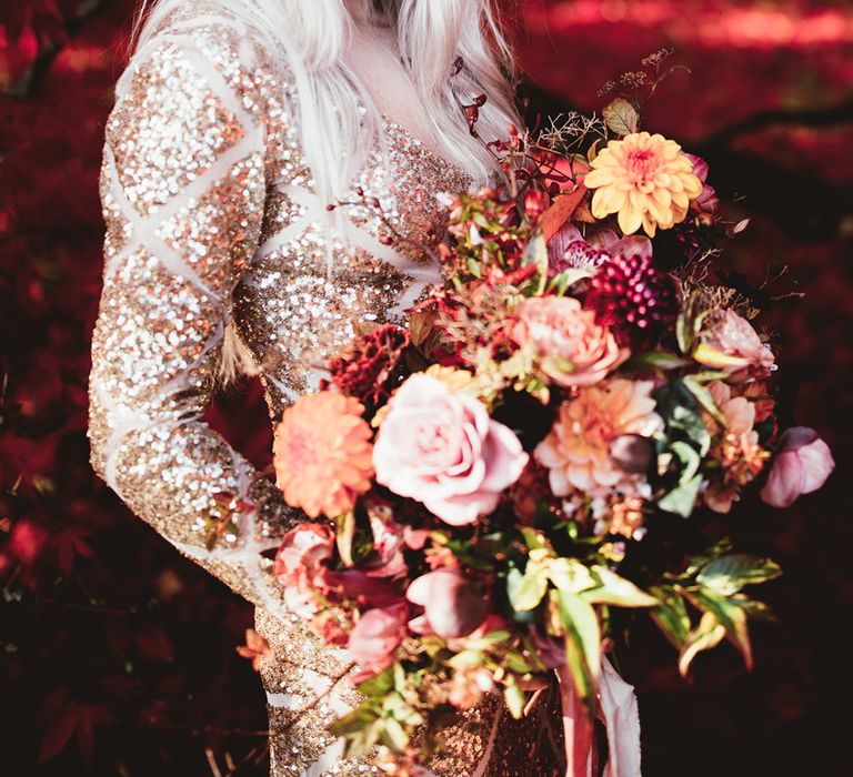 Bride in gold sequin dress with oversized pink bouquet. Photography by Maryanne Weddings.