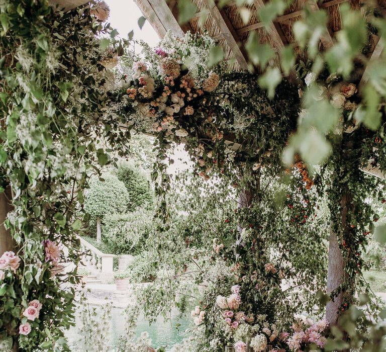 Pink and white floral installation at Euridge Manor Orangery wedding with roses, dahlias and hydrangeas