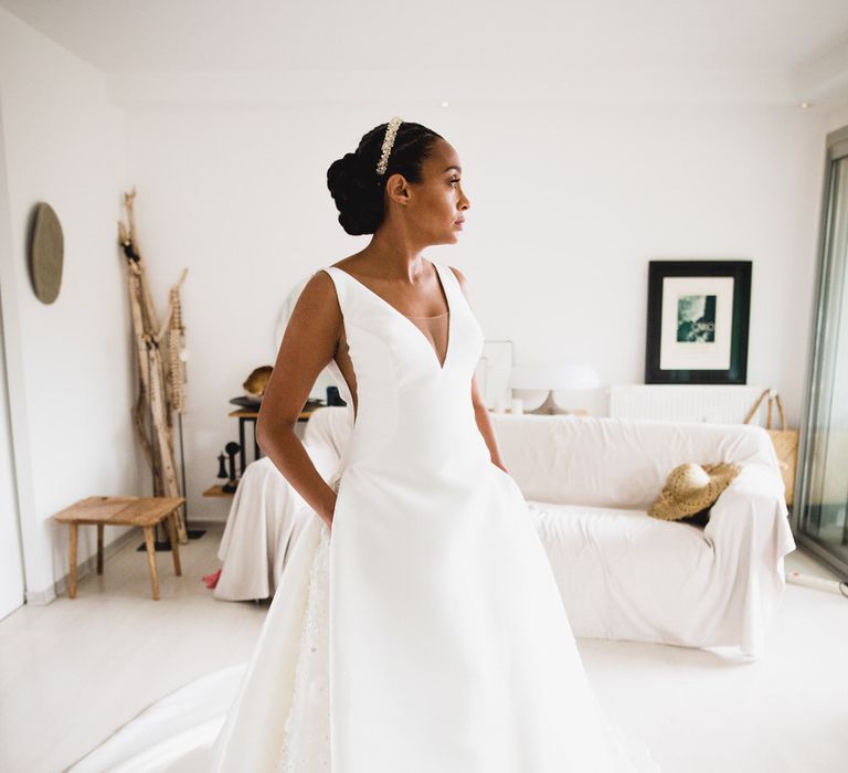 The bride looking stunning in a classic white Atelier Pronovias dress with pockets and a hidden floral detail panel