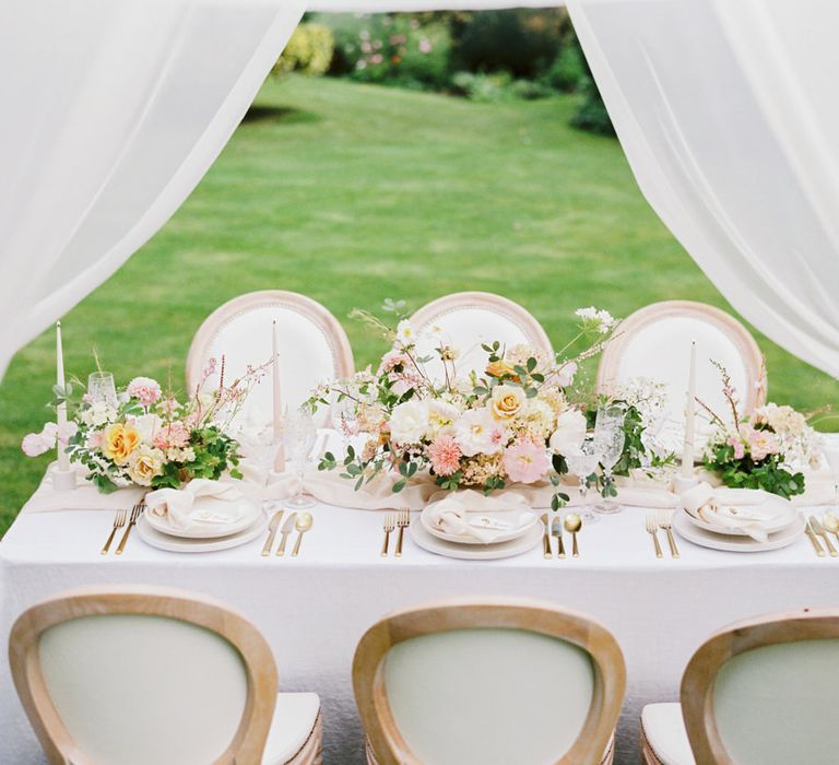 Intimate and romantic English garden party wedding reception with blush and white colour palette