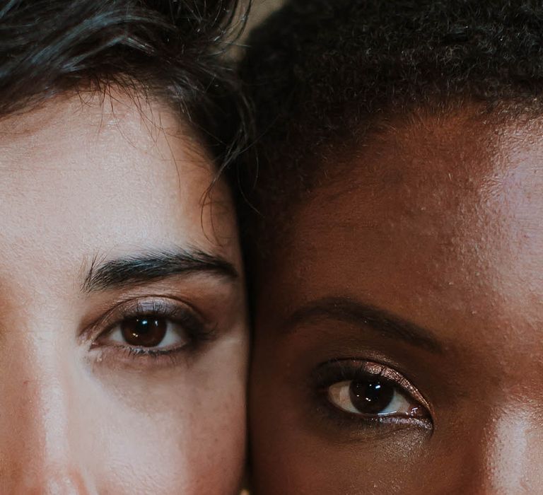 Two brides with shimmering gold and smokey eye shadow 