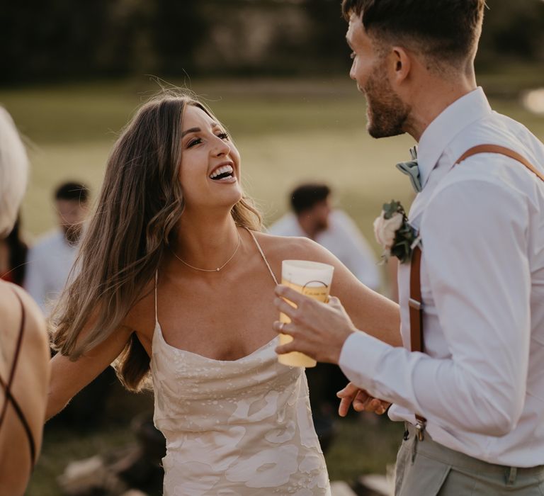 Bride & groom dance and smile during reception on their wedding day | Mark Bamforth Photography