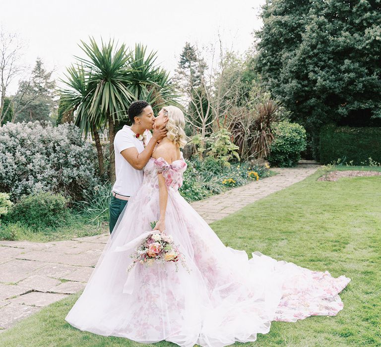 LGBTQI+ couple kissing in the gardens at Barnett Hill Hotel 