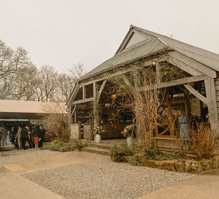 Nancarrow Farm wedding venue with outside area covered with canopy where guests socialise