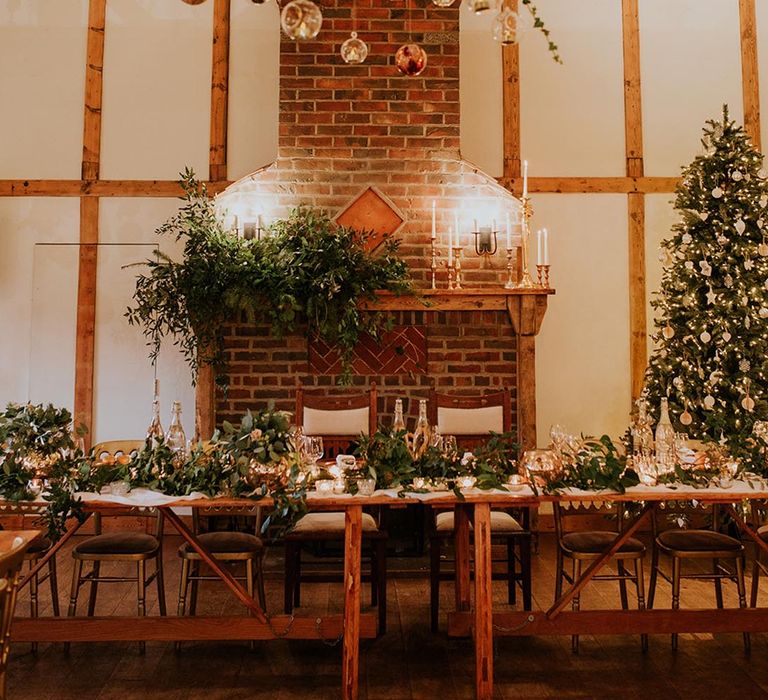 A hanging centrepiece with baubles, fairy lights and a Christmas tree