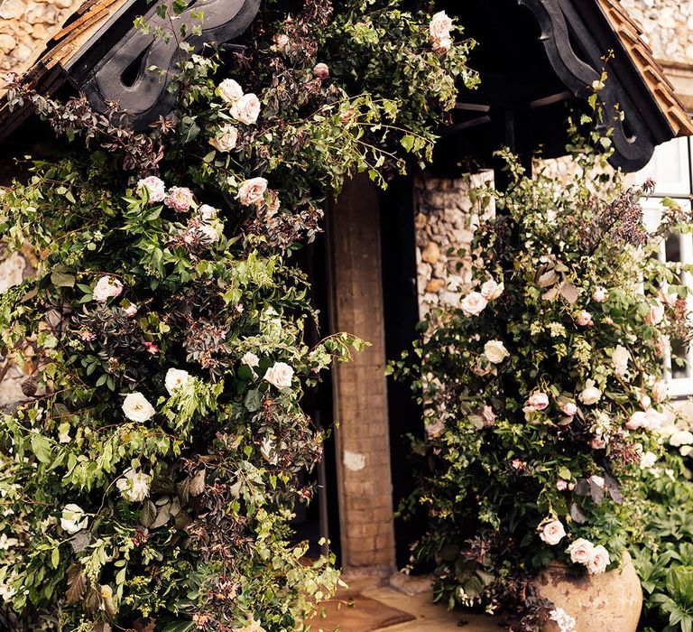 White and pink rose wedding flower columns 