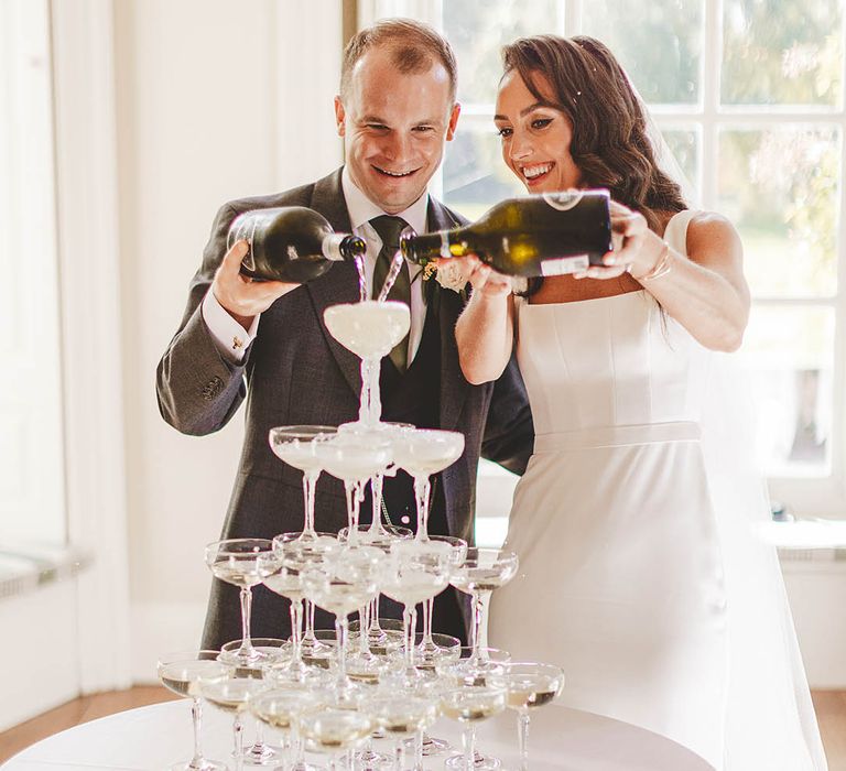 Win wedding photography with We Are // The Clarkes and get the chance to have fun champagne photos like this image featuring a champagne tower