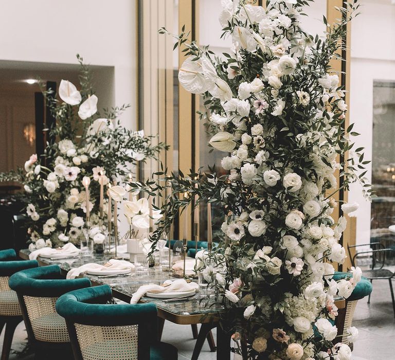 White flower columns with white anthuriums, white poppies, and white peonies for elopement in Paris 