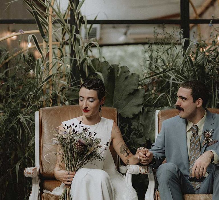 Lisa in pre-loved wedding dress sits beside Gabriel in powder blue Gucci suit 