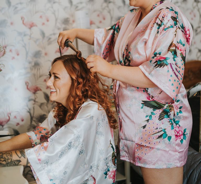 wedding morning bridal preparations in floral satin getting ready robes 