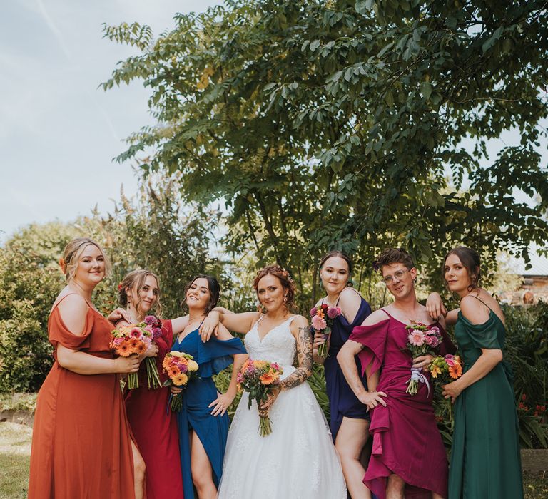 I do crew in different coloured bridesmaid dresses and bride in a lace wedding dress