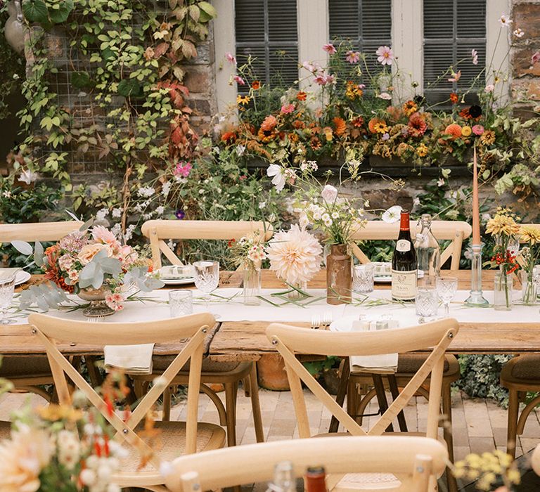 Floral wedding table decor for orange theme classic country house wedding 