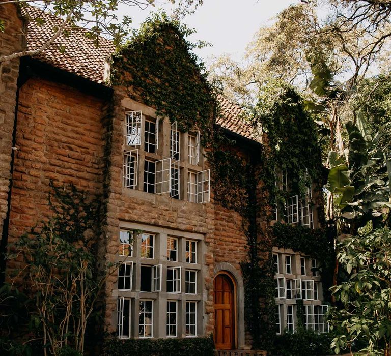 Giraffe Manor wedding venue in Kenya, East Africa with yellow chairs 