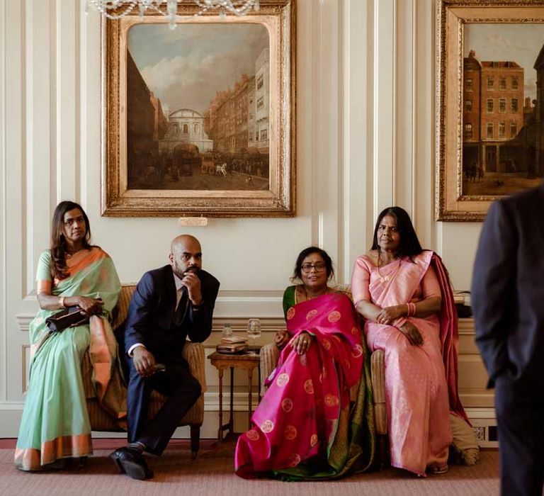 Wedding guests sitting inside Inner Temple Hall for vow renewal 