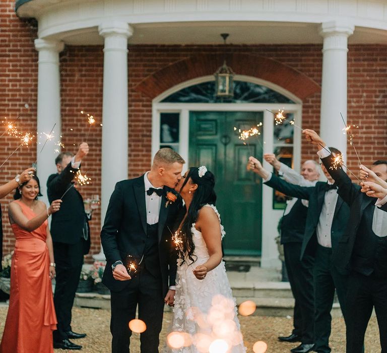 Sparkler send off for the bride and groom at their Reymerston Hall wedding 