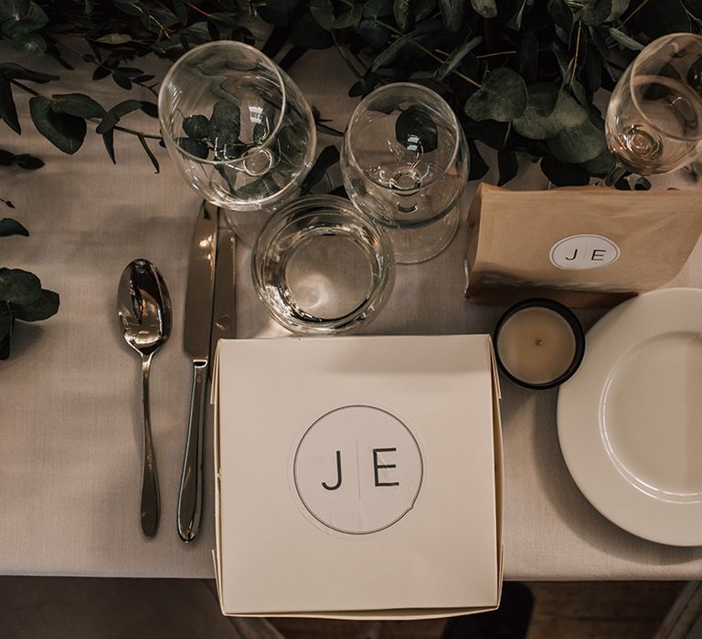 Monogrammed personalised doughnut wedding favours box with candle and other goodies 