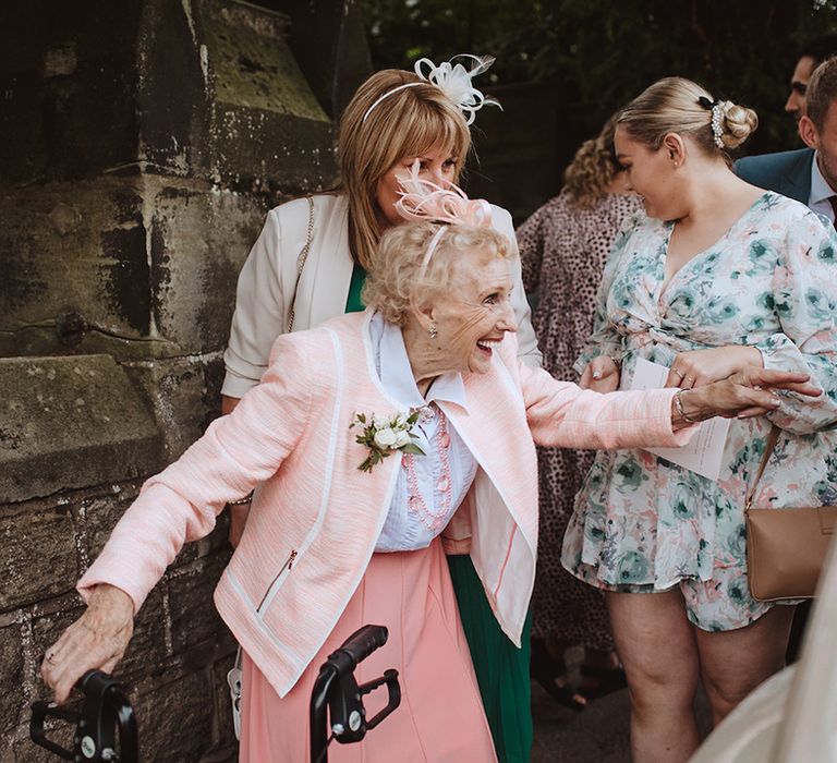 Wedding guest in blush pink theme wedding outfit to match the wedding day 