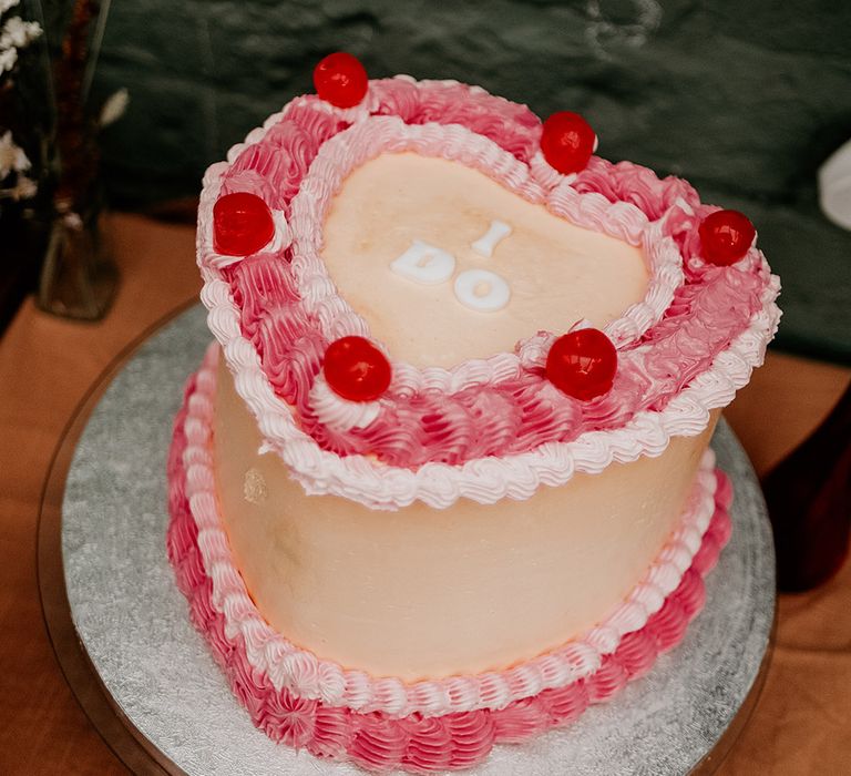 DIY homemade heart shaped retro wedding cake spelling out 'I Do' 