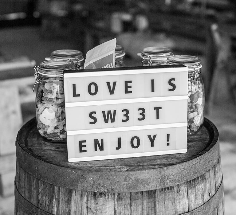 Sweet jars for wedding favours with light up letter signage 