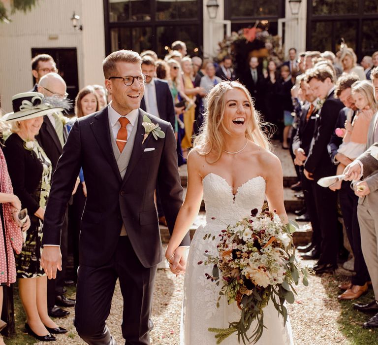 Confetti moment for bride and groom