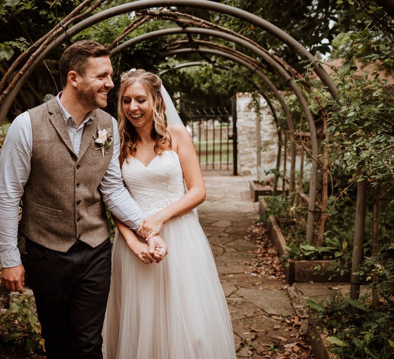 Intimate Kent wedding with bride in a blush wedding dress and groom in tweed waistcoat 