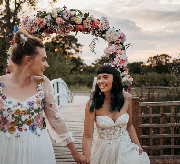 Brides in a flower embroidered wedding dress and strapless wedding dress