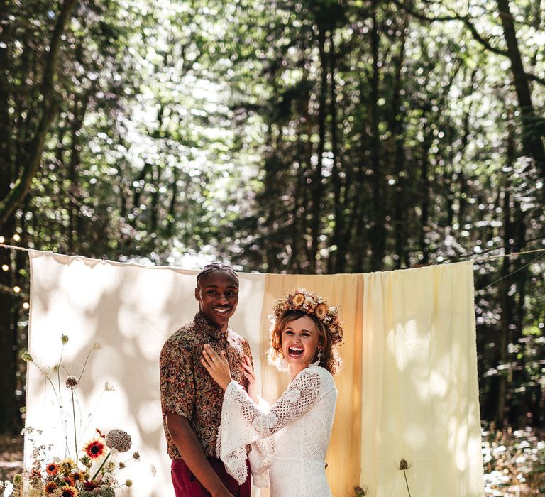 Bride & groom in Longton Wood in boho wedding decor 