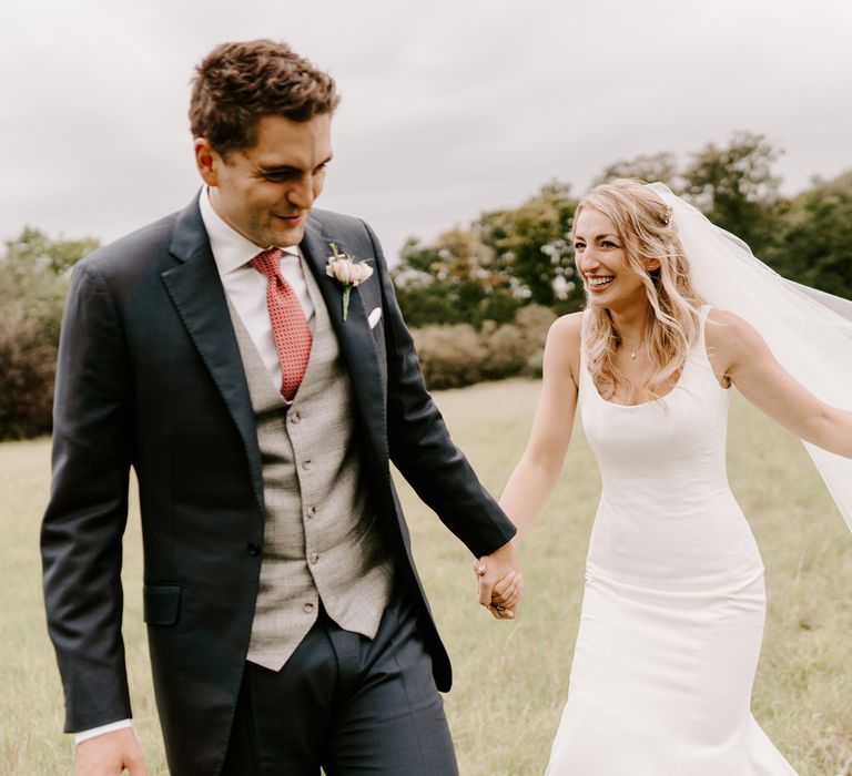 Bride and groom laughing during the couples session 