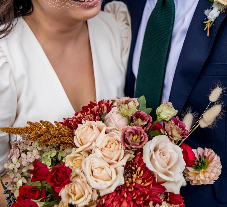 Asian bride in birdcage veil and Tilly Thomas Lux bridal crown