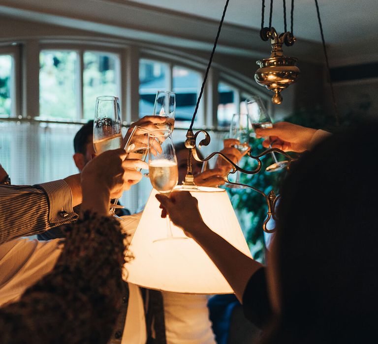 Champagne celebrations as guests cheers at London wedding