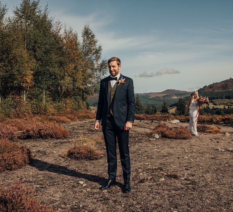 Bride & groom walk through the Scottish countryside together on wedding day