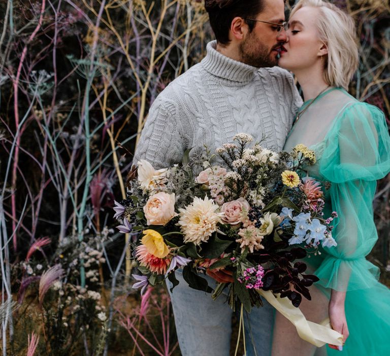 Oversized colourful wedding bouquet tied in ribbon 