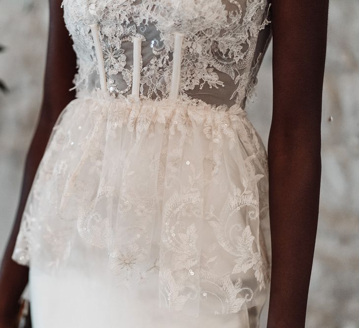 Fitted lace bodice and peplum detail on Felisiti Greis wedding dress