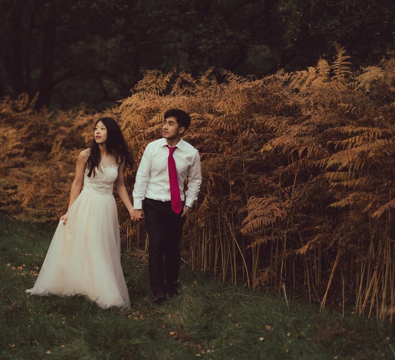 Couple walk together through the countryside