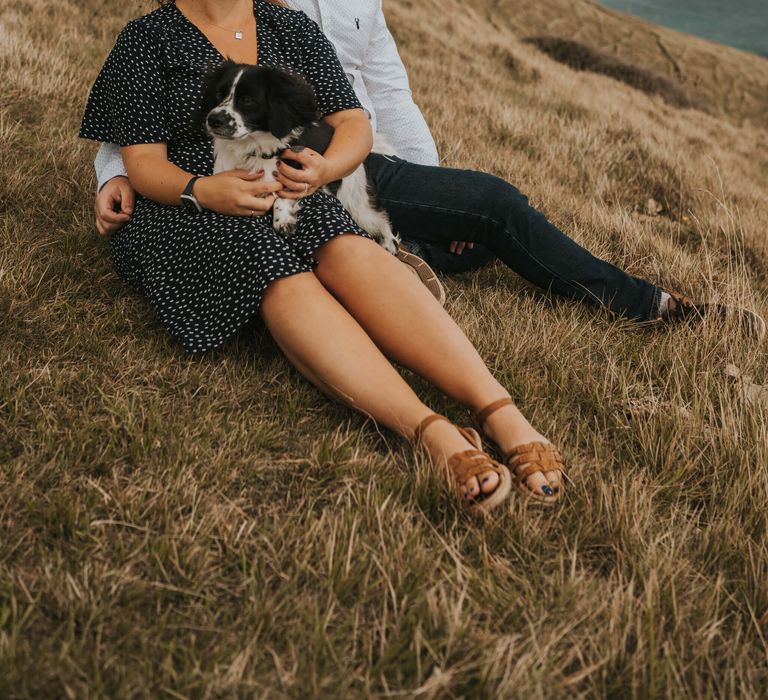 Newly engaged couple at durdle door bay with their dog