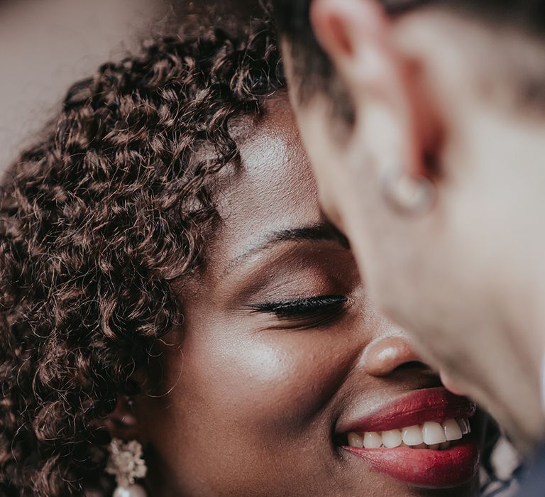 Bride looks lovingly at her husband on wedding day