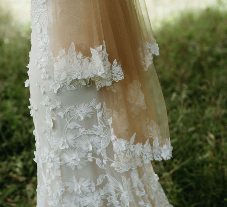 Floral embroidered wedding dress with matching tulle bridal cape for boho wedding at Berwick Lodge