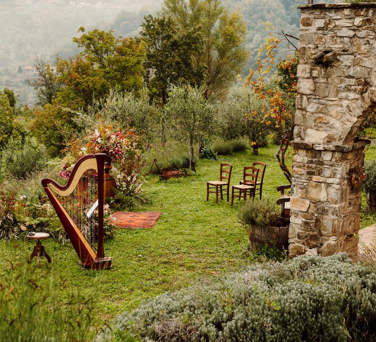 Intimate elopement in Italy with four guests and a harpist in an olive grove