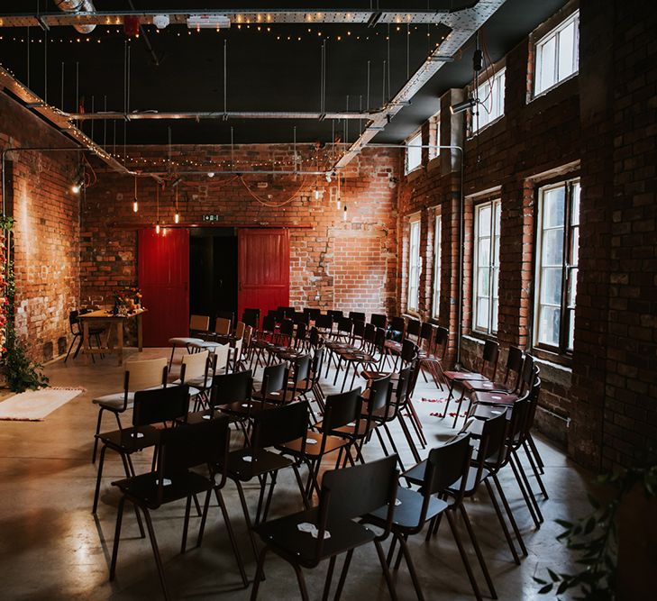 Rows of seats are set out in a semi circle for a wedding ceremony.