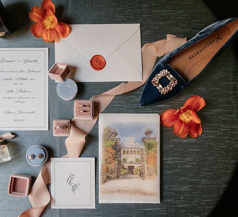 Wedding stationery complete with vintage feel beside gold wedding rings and Manolo Blahnik wedding shoes 