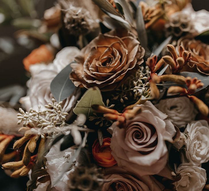 Dried florals in Autumnal colour scheme with roses and pampas grass for bridal bouquet