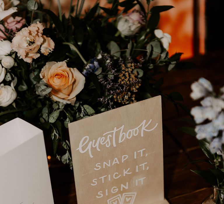 Polaroid wedding guest book with wooden guest book sign 