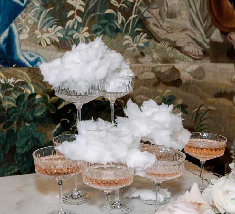 Wedding pink champagne tower with candy floss champagne toppers 