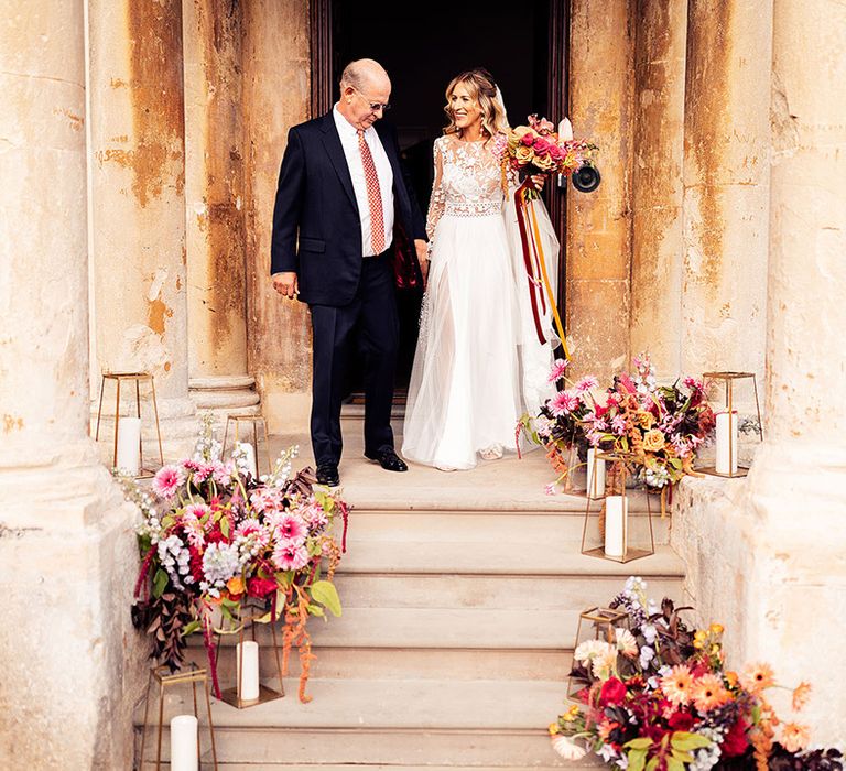 Father of the bride walks the bride to the wedding at Elmore Court in Gloucestershire 