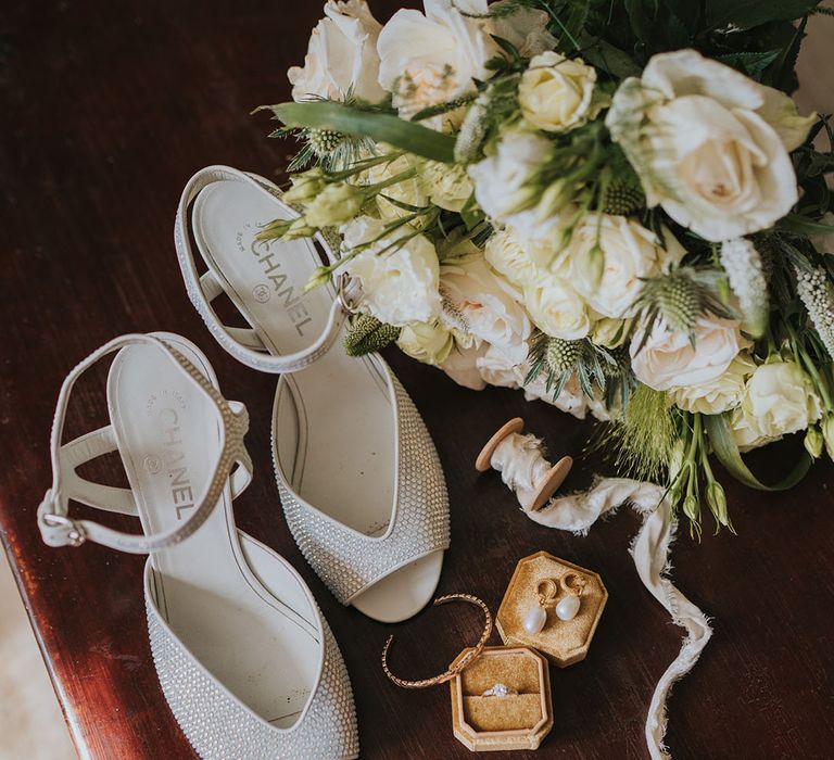 Sparkly Chanel sparkly wedding shoes with white rose bouquet and Chanel wedding perfume 