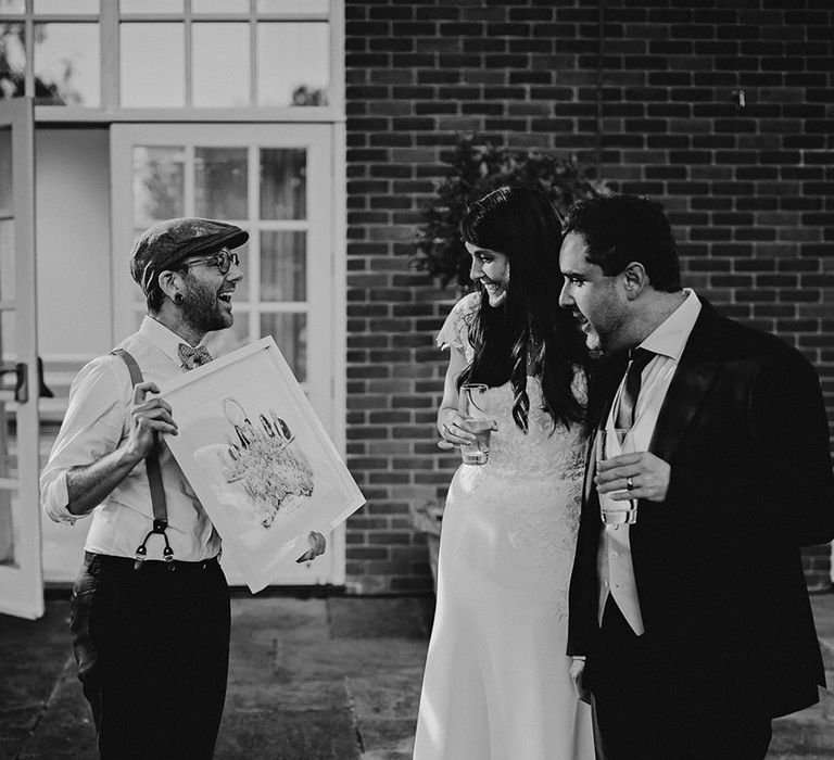 The bride and groom react to their live wedding illustrator