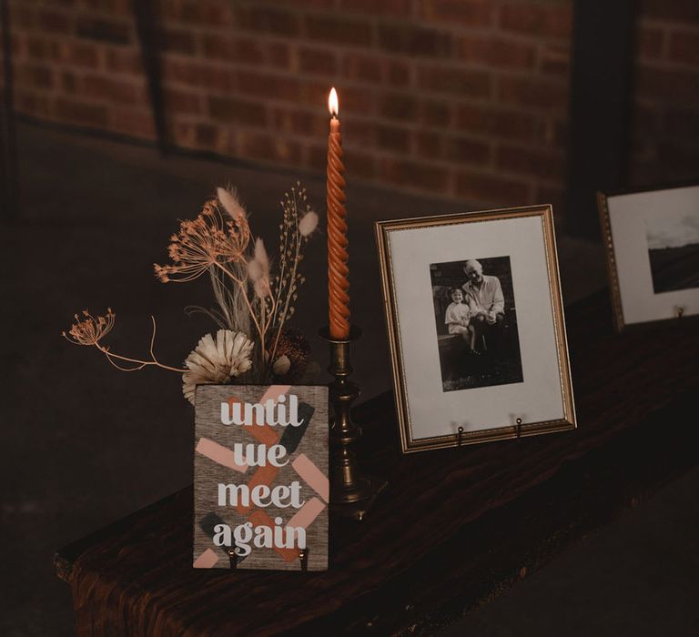 Wedding decor with signage and photos to memorialise lost loved ones 